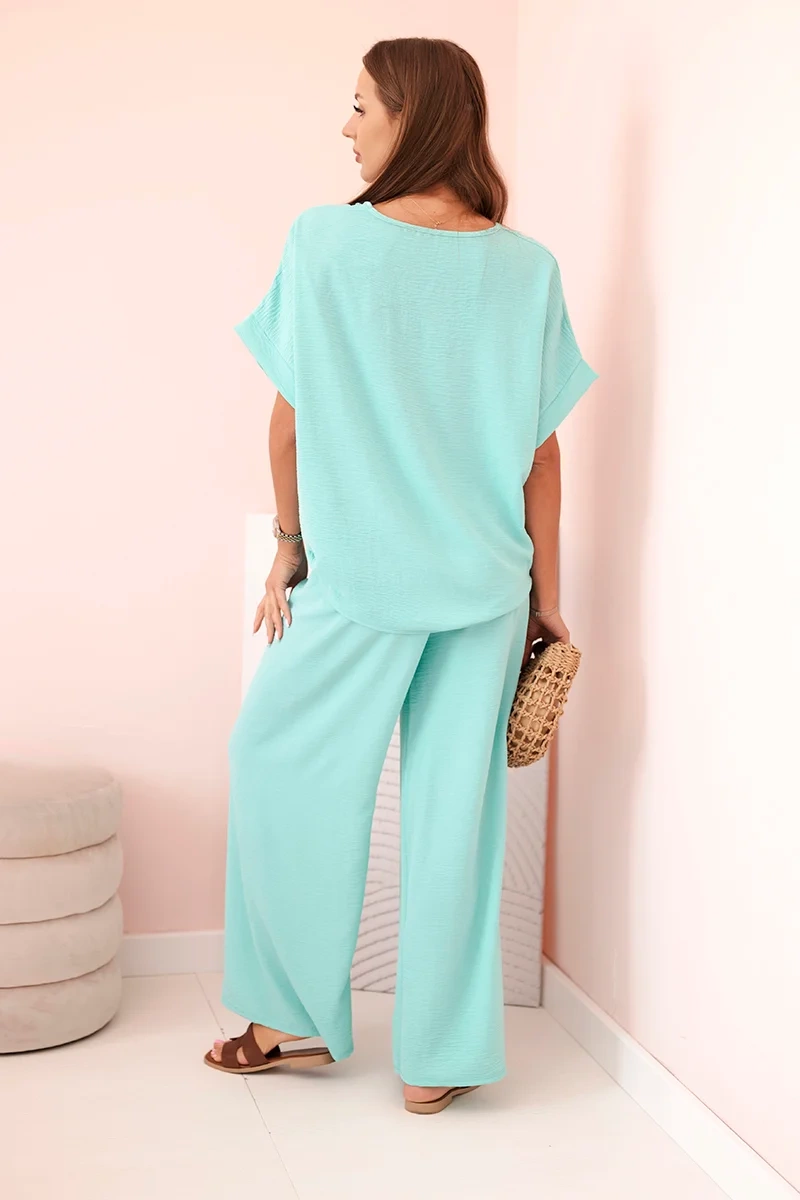 Komplet damski z wiskozy z ozdobnym kwiatem i szerokimi spodniami miętowy - obrazek 3