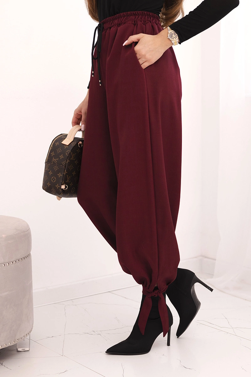 Spodnie damskie z szeroką nogawką i wiązaniem u dołu bordowe