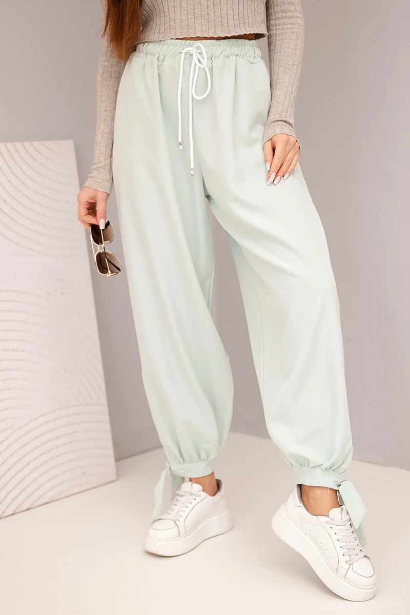 Spodnie damskie z szeroką nogawką i wiązaniem u dołu ciemno miętowe