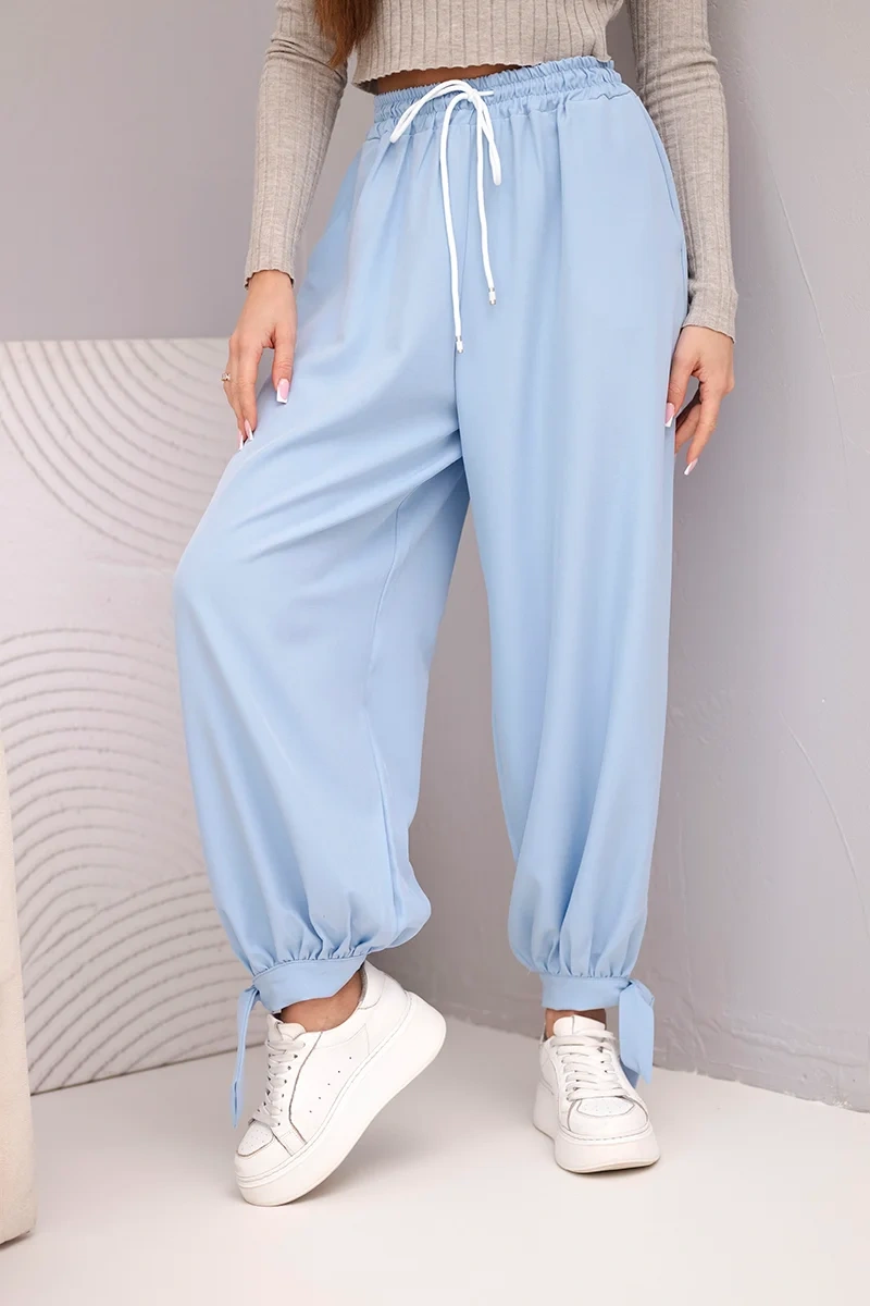 Spodnie damskie z szeroką nogawką i wiązaniem u dołu niebieskie