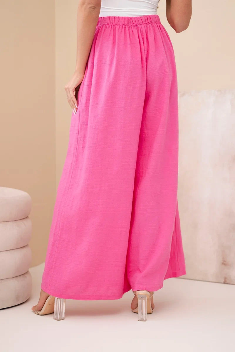 Spodnie damskie szerokie bawełniane z gumką w pasie różowe - obrazek 3