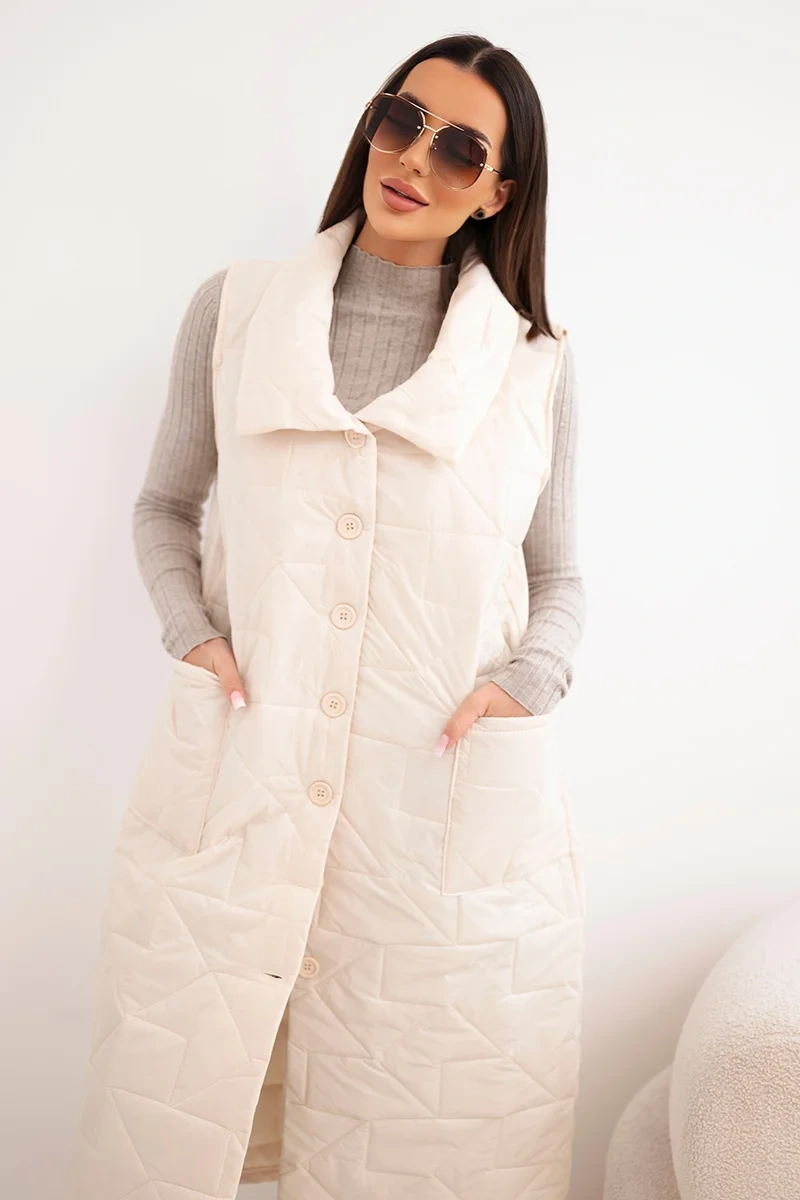 Kamizelka damska pikowana długa z kieszeniami i stójką jasno beżowa