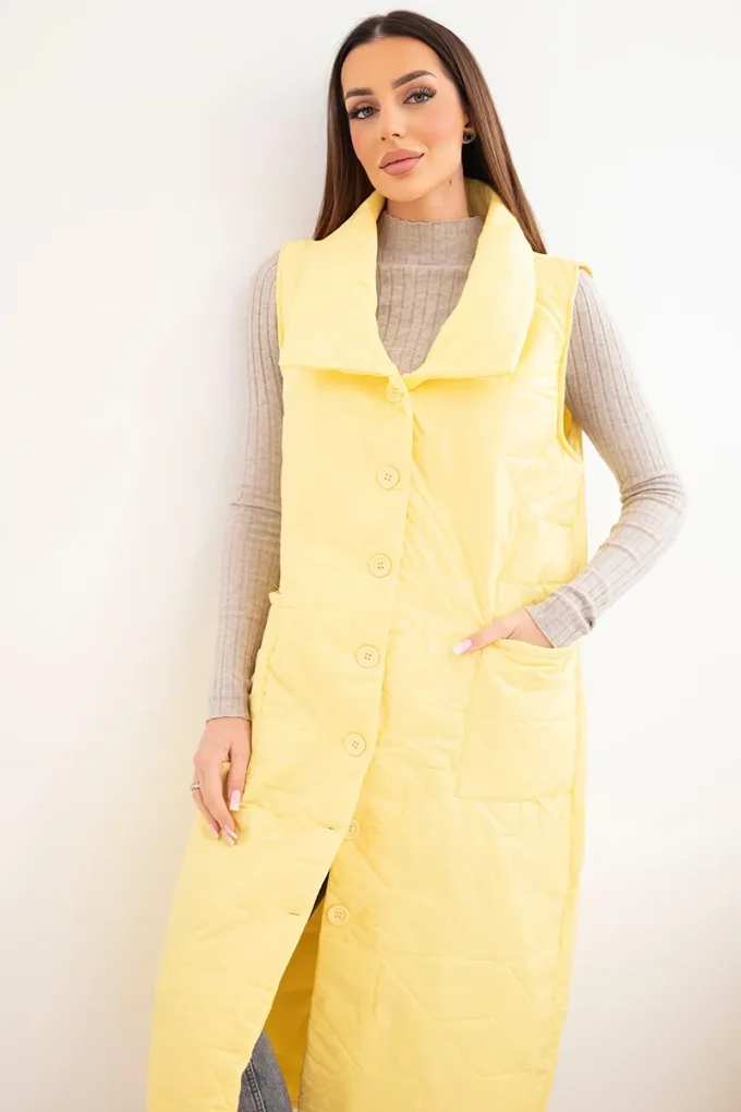 Kamizelka damska pikowana długa z kieszeniami i stójką żółta