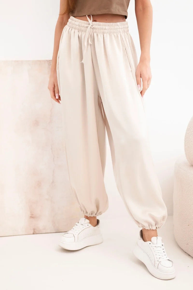 Spodnie damskie szerokie z gumką w pasie i wiązaniem typu alladynki beżowe